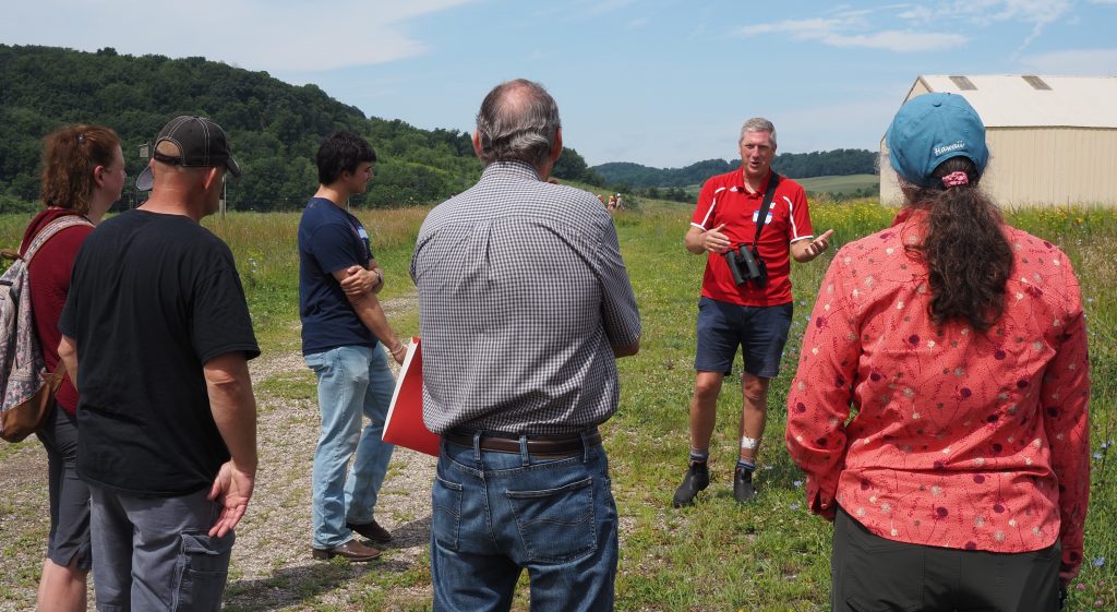 David Drake talks with landowners about grassland wildlife at a Getting Started with Stewardship Field Day at the Sauk County Farm.